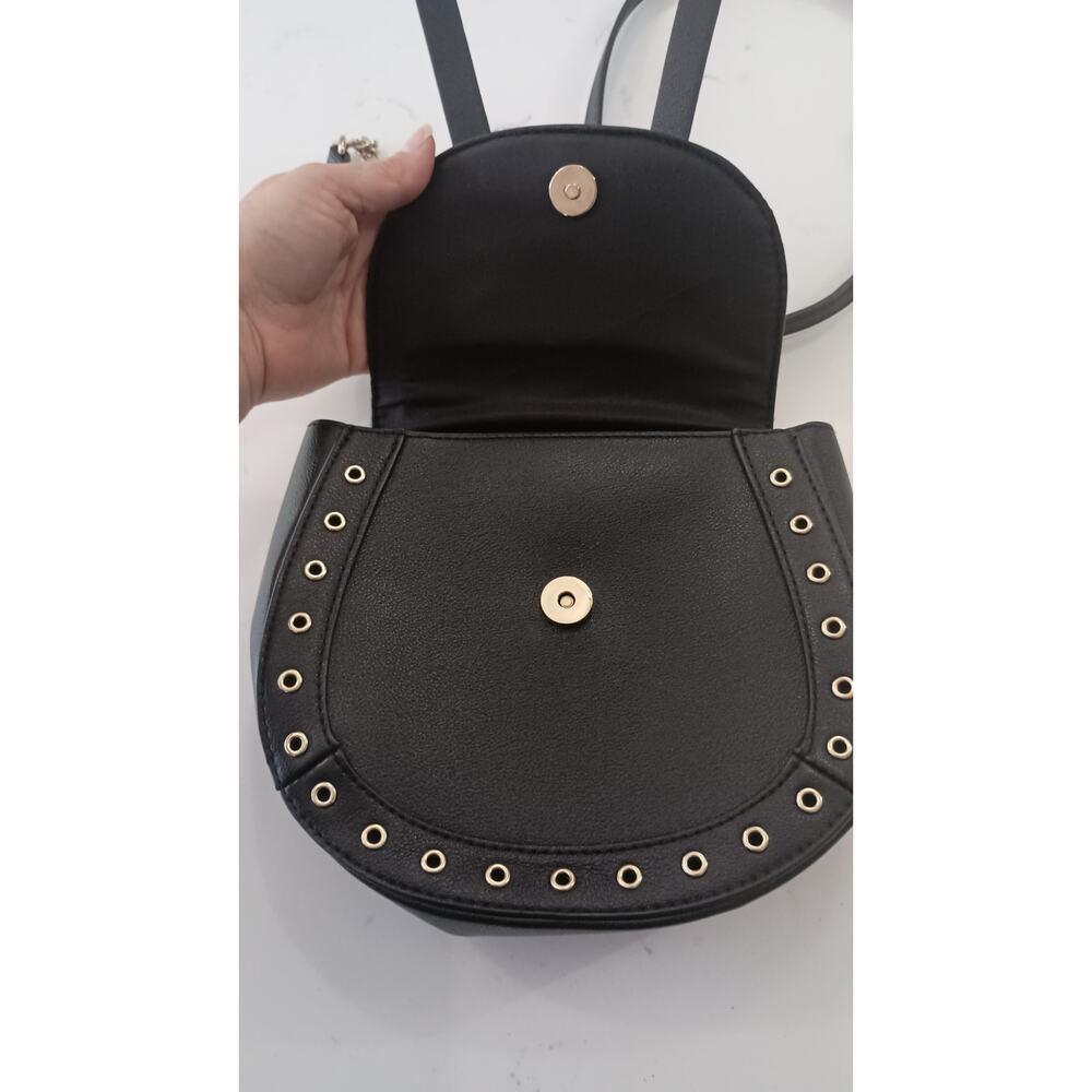 The Express Black Crossbody embellished with Bow metal grommets flap  closure. - Picture 6 of 12